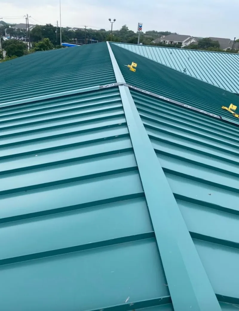 Green commercial metal roof ridge and valley for Metal Roof Repair in Ketchikan